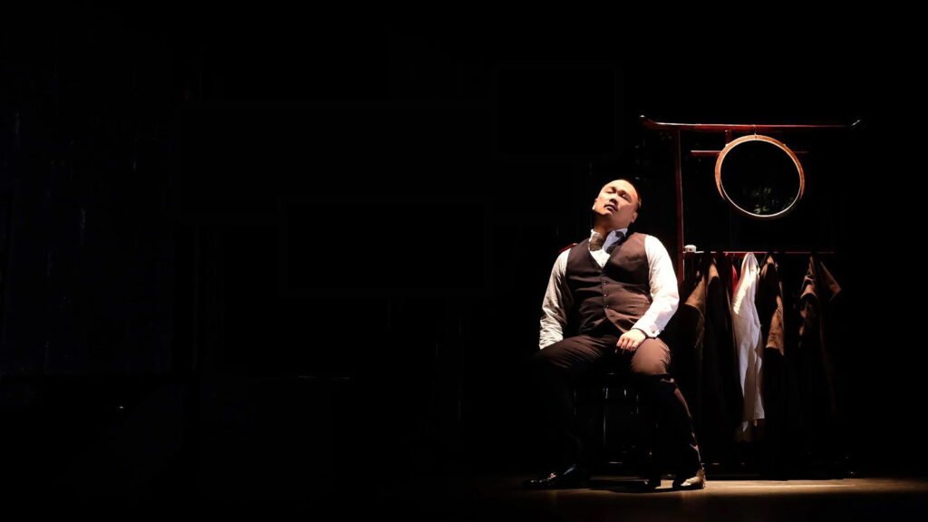 derek seated solo with eyes close